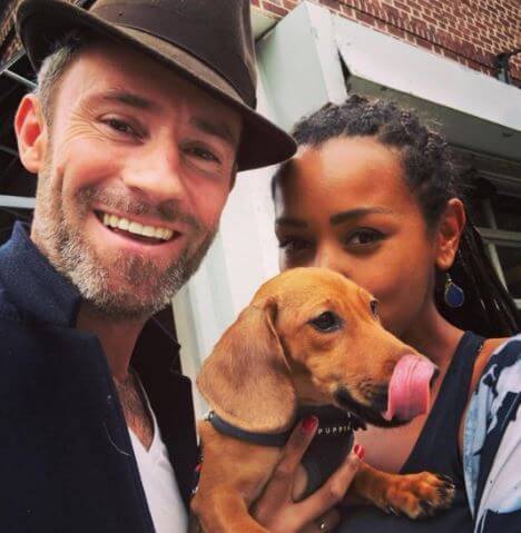 Melanie Liburd with her husband, Ben Taylor, and pet Winston.